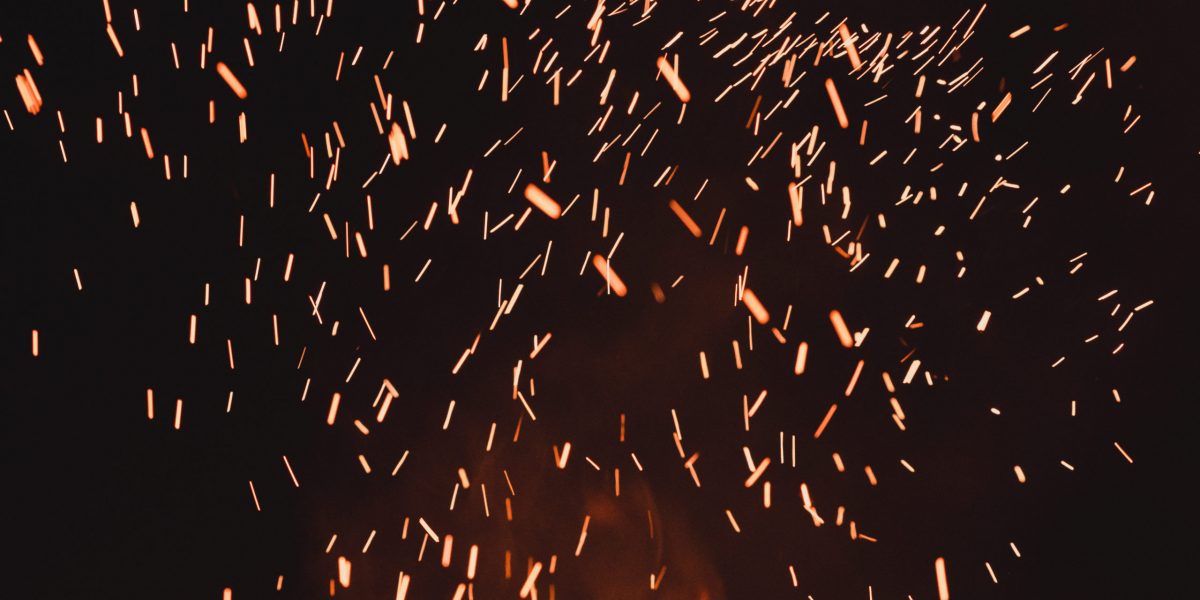 close up of sparks from fire, sparks on black background, extravaganza of fire, magic with sparks.2020